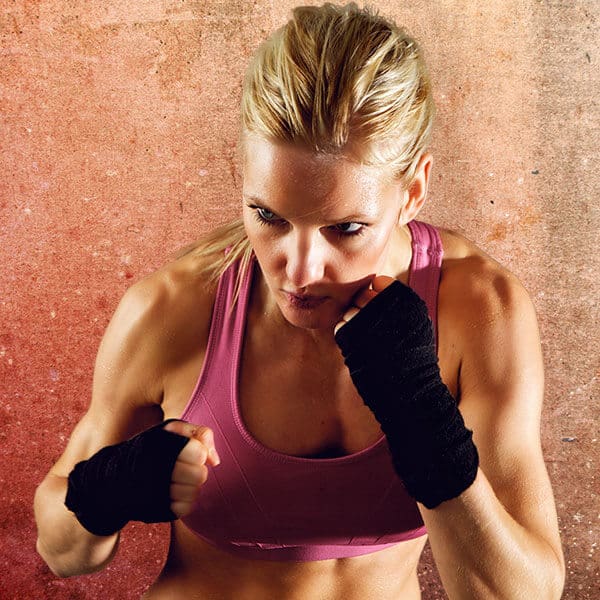 Mixed Martial Arts Lessons for Adults in Falls Church VA - Lady Kickboxing Focused Background