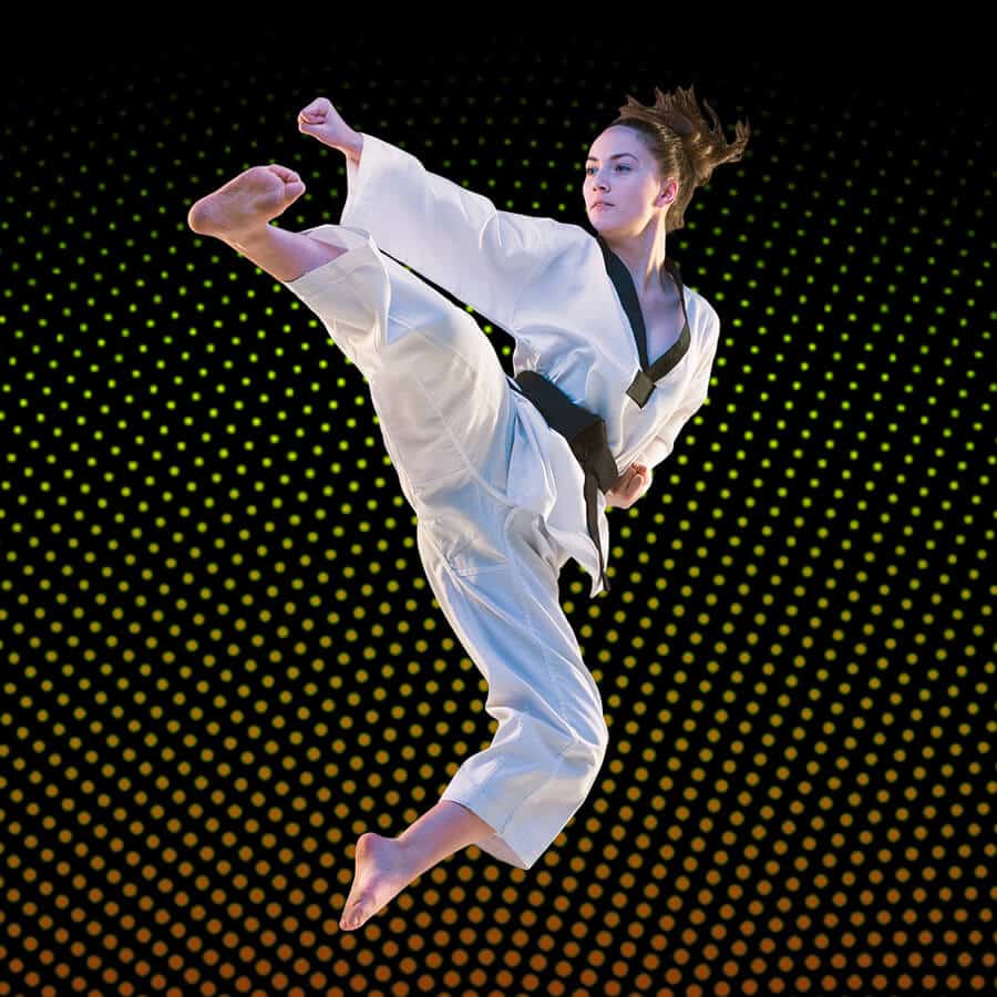 Martial Arts Lessons for Adults in Falls Church VA - Girl Black Belt Jumping High Kick