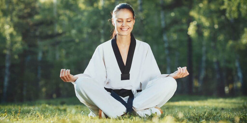 Martial Arts Lessons for Adults in Falls Church VA - Happy Woman Meditated Sitting Background